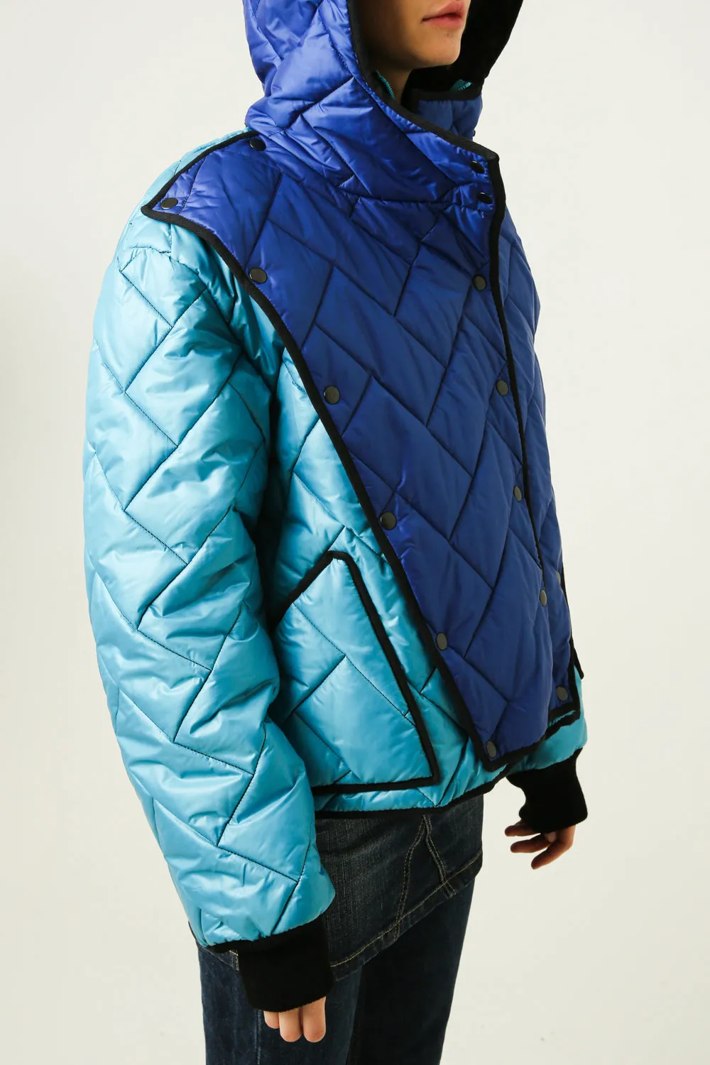 Down jacket in the style of deconstruction